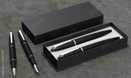 фотографія Writing set. Ball pen and ink pen in a box on a concrete backgro