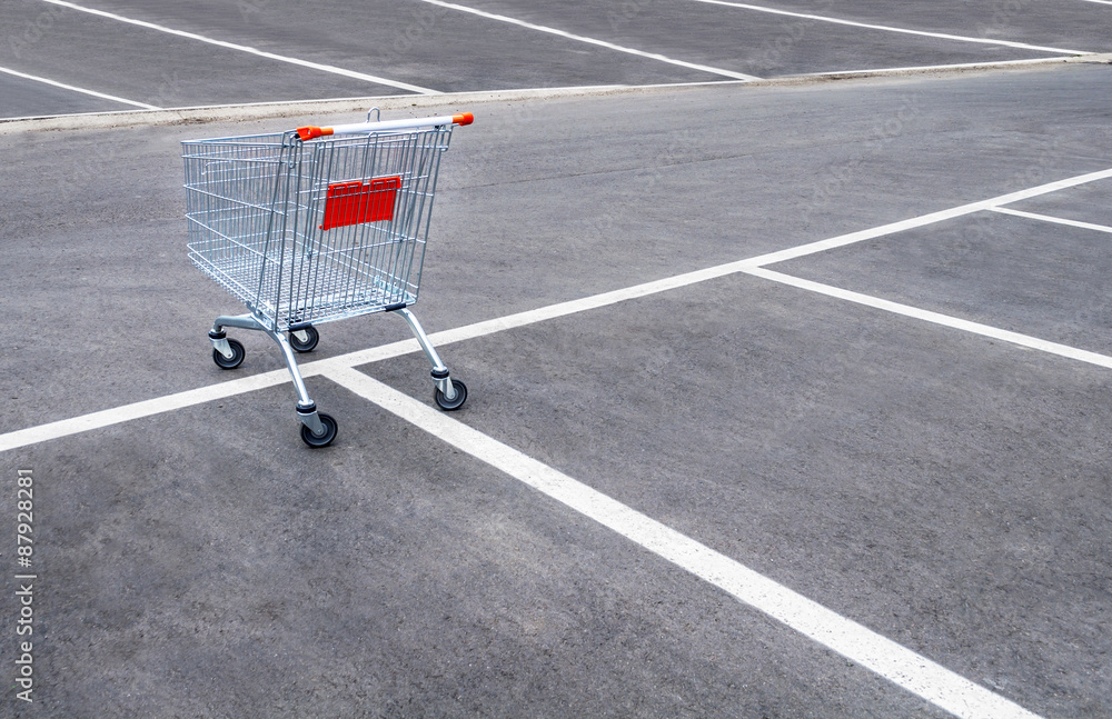 Empty shopping carts on a empty parking lot Empty shopping carts on a empty parking lot