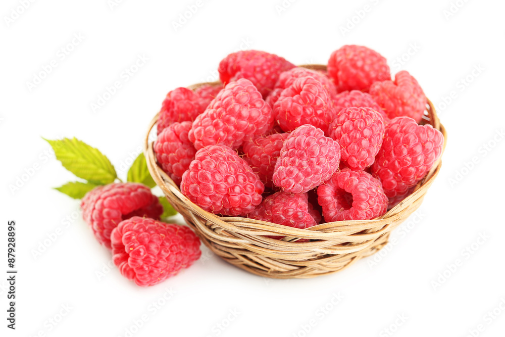 Red raspberry in basket isolated on a white Red raspberry in basket isolated on a white