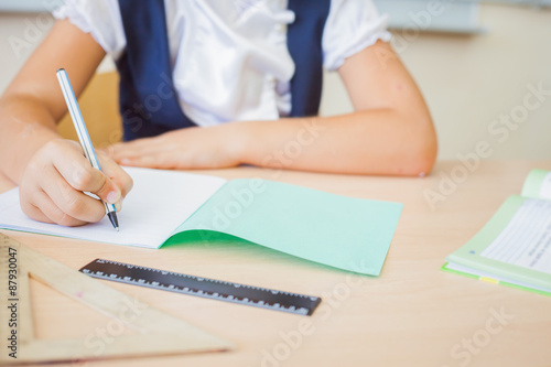 Desktop background of student sitting at desk for classwork