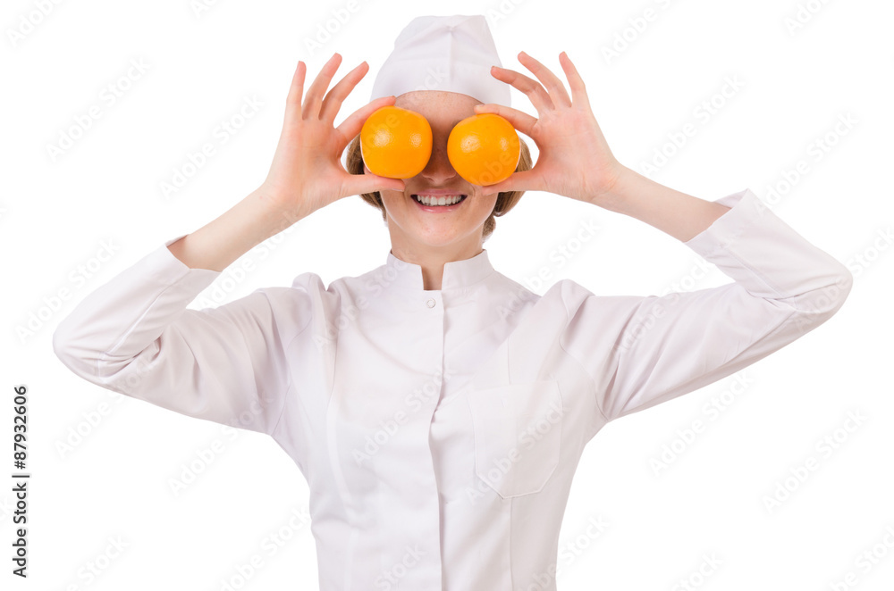 Pretty female doctor holding orange isolated on white Pretty female doctor holding orange isolated on white