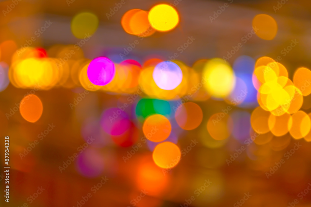 Obraz premium blurred bokeh background with warm orange lights (blurred)