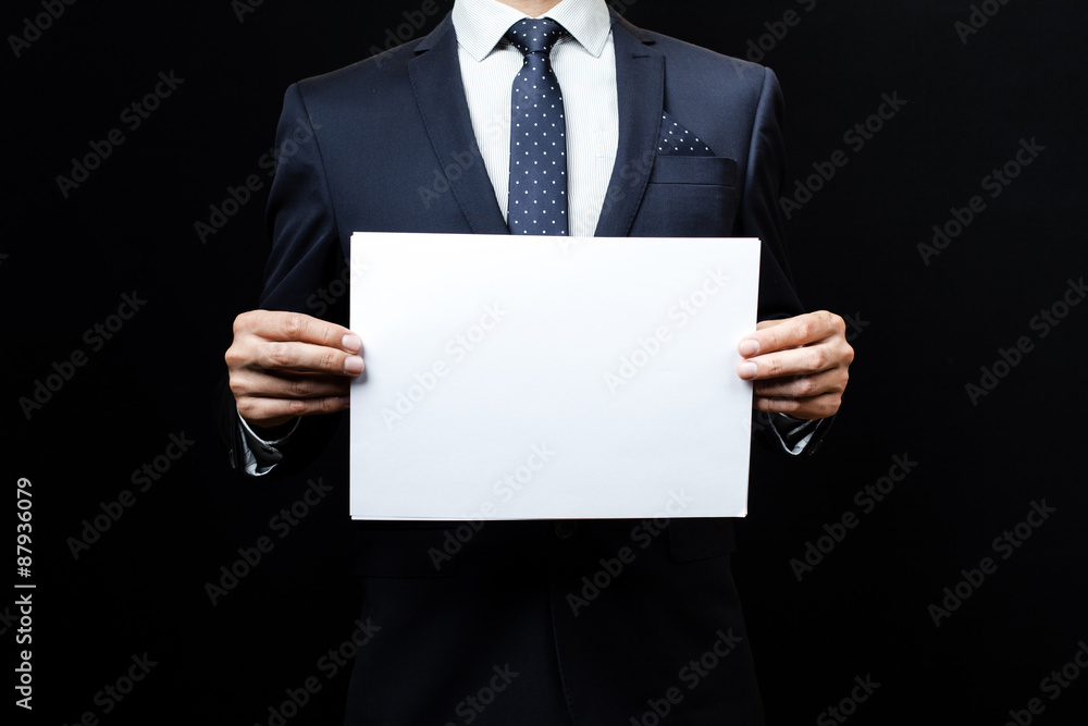 business man holding a paper business man holding a paper