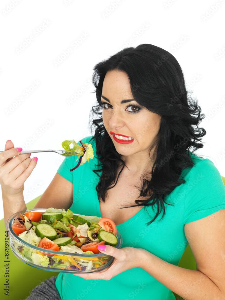 Young Woman Eating a Fresh Crisp Mixed Garden Salad Young Woman Eating a Fresh Crisp Mixed Garden Salad