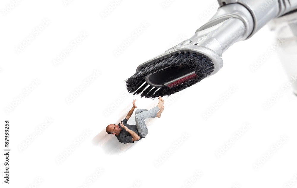 Man being sucked by a vacuum cleaner