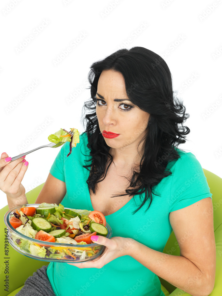 Young Woman Eating a Fresh Crisp Mixed Garden Salad Young Woman Eating a Fresh Crisp Mixed Garden Salad