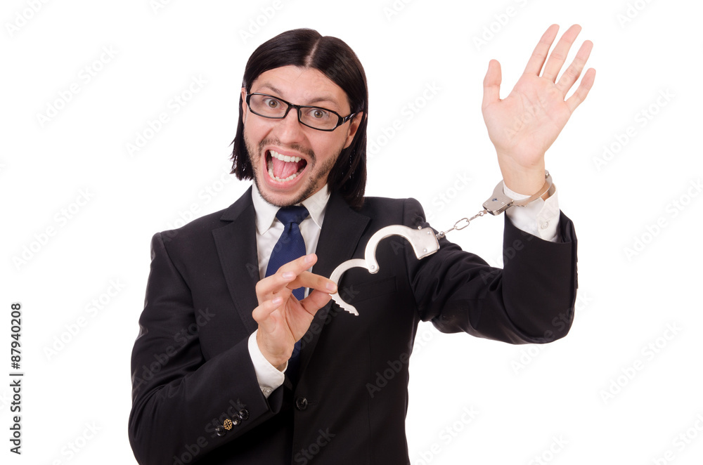 Young businessman in handcuffs isolated on white Young businessman in handcuffs isolated on white