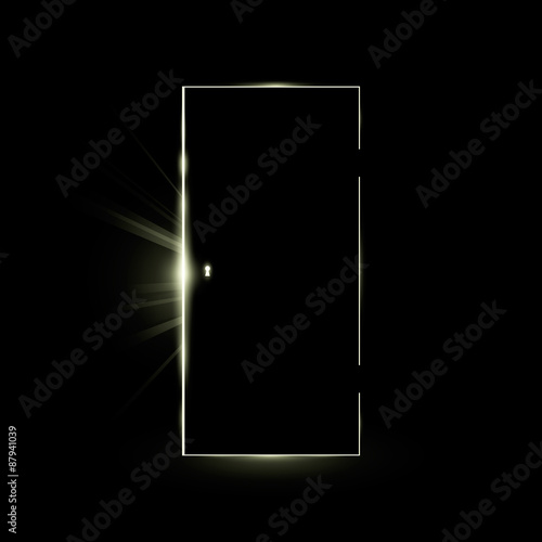Opening black door in a dark room with shining light.