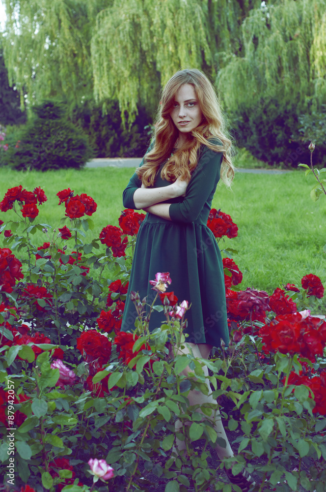 Mysterious caucasian woman with green eyes and green dress looki Mysterious caucasian woman with green eyes and green dress looki
