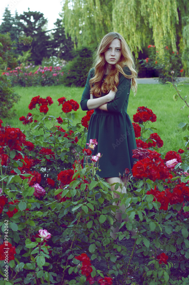 Mysterious caucasian woman with green eyes and green dress looki Mysterious caucasian woman with green eyes and green dress looki