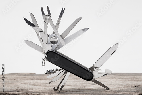 Knife multi-tool, isolated on white background photo