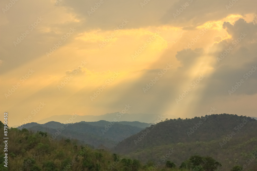 sun shining through cloud