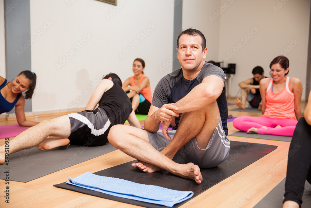 Portrait of Hispanic man enjoying yoga class Portrait of Hispanic man enjoying yoga class