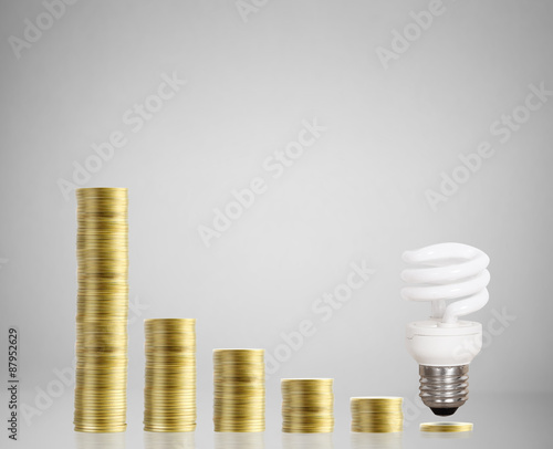 Bulb With Stack Of Coins