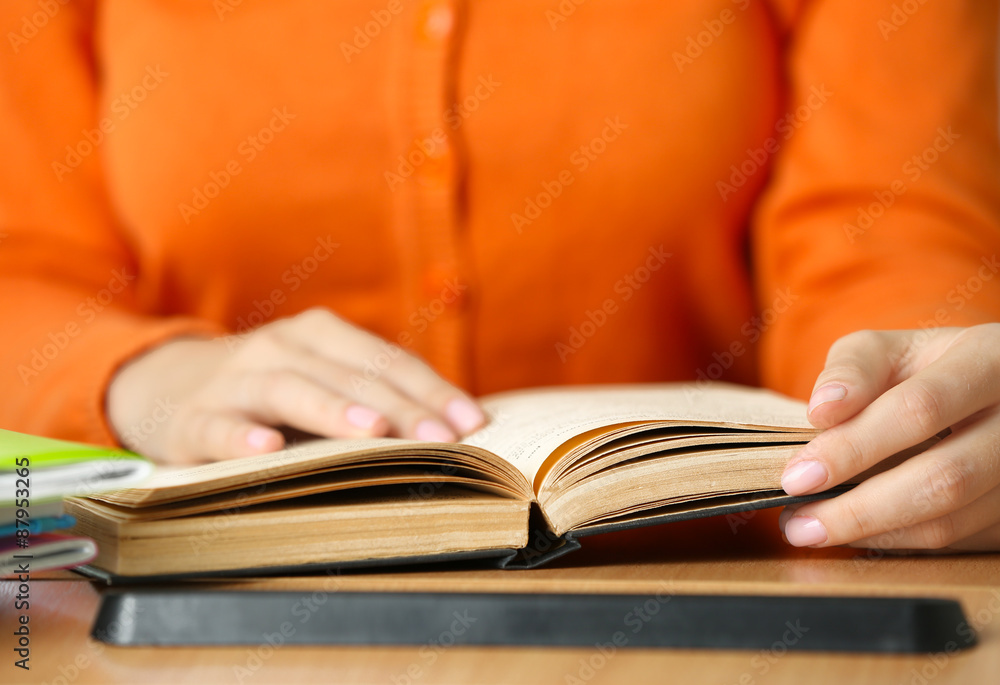 Student reading book, close-up Student reading book, close-up