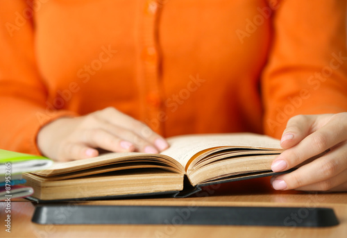 Student reading book, close-up