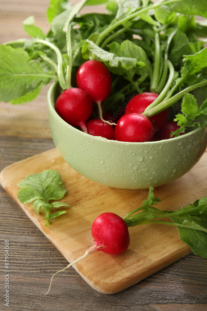 Fresh red radish on wooden table, closeup Fresh red radish on wooden table, closeup