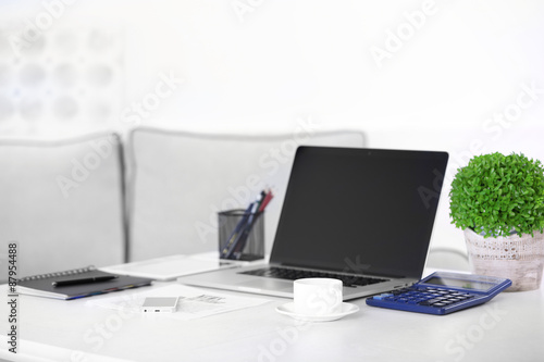 Modern workplace with laptop, close up