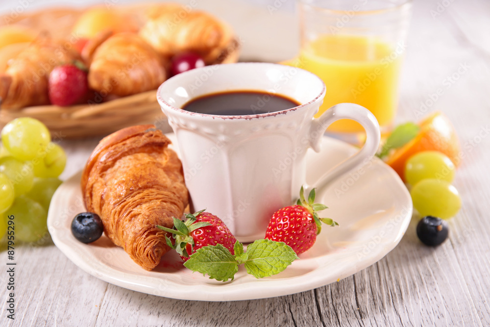 coffee cup and croissant coffee cup and croissant