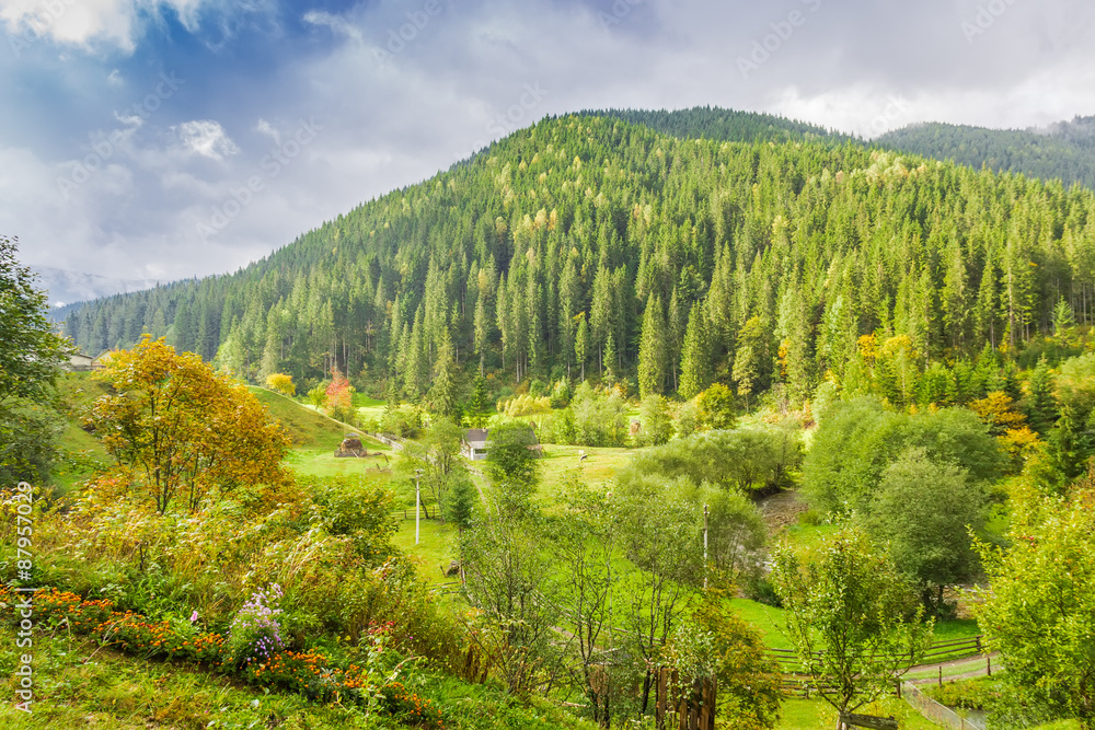 Mountain landscape with rural outbuildings autumn