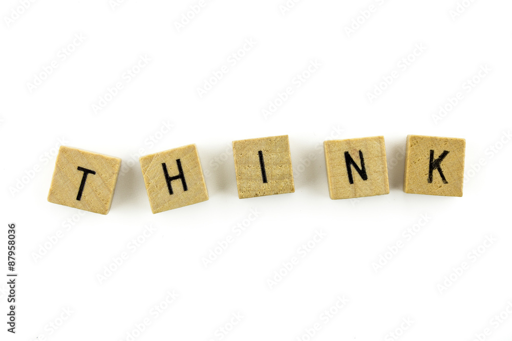 THINK text on wooden cubes, isolated on white background THINK text on wooden cubes, isolated on white background