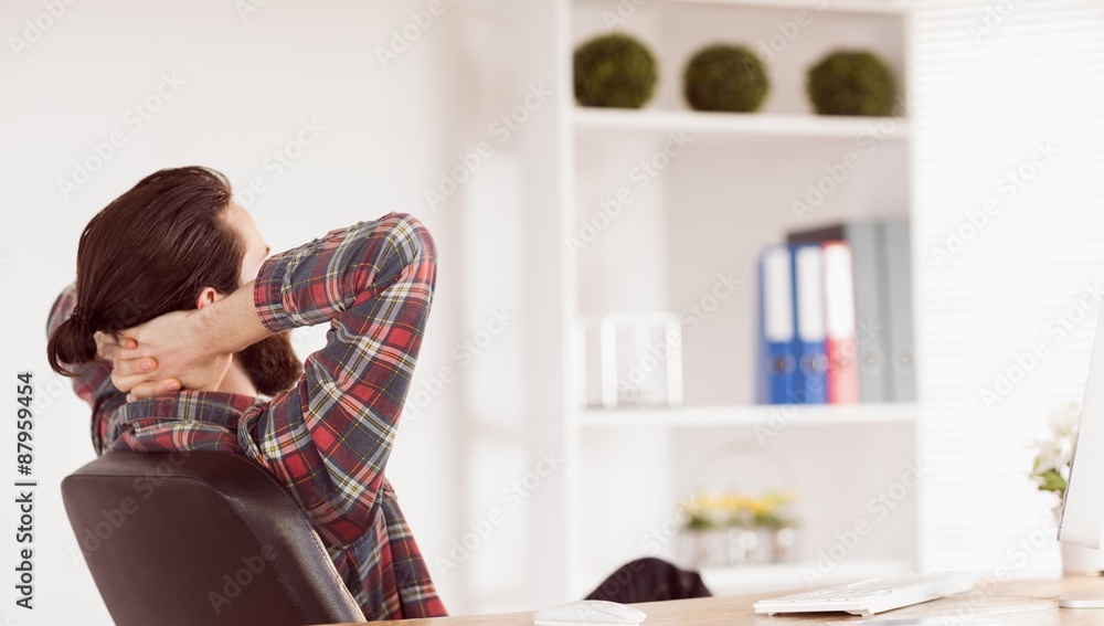 Hipster businessman relaxing at his desk Hipster businessman relaxing at his desk