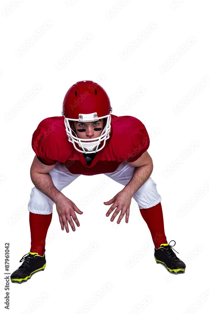 American football player in attack stance