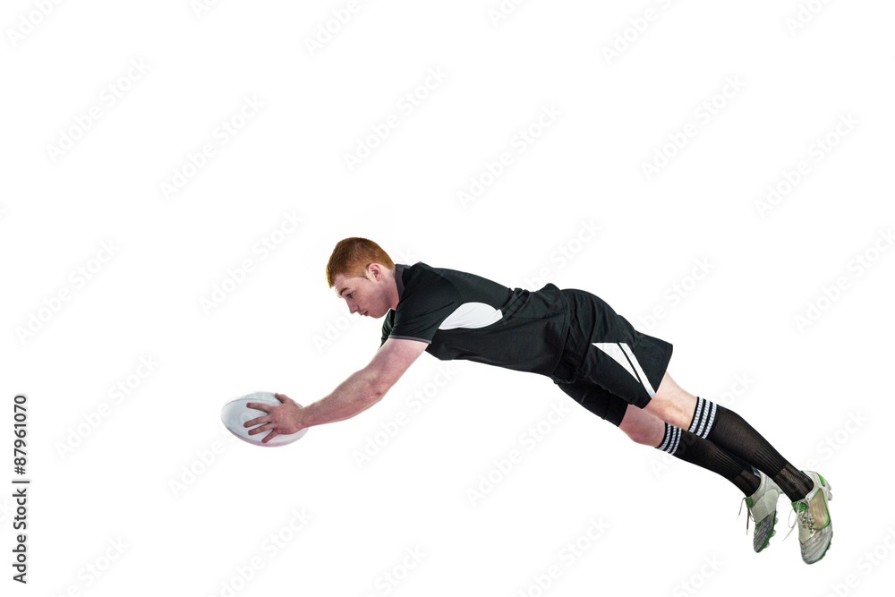 Fototapeta A rugby player scoring a try