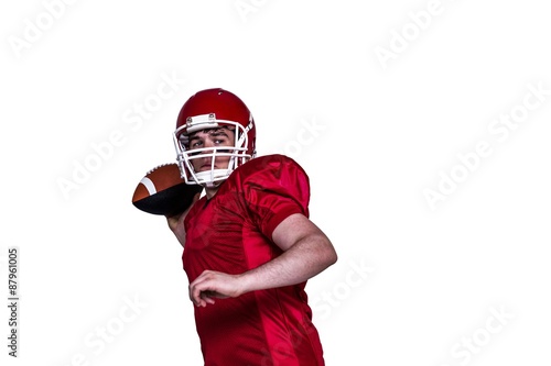 American football player throwing a ball