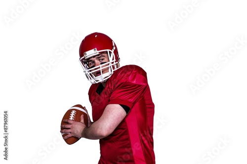 American football player throwing a ball
