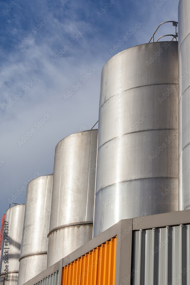 Large metal industrial tanks for petrol and oil storage in refin Large metal industrial tanks for petrol and oil storage in refin