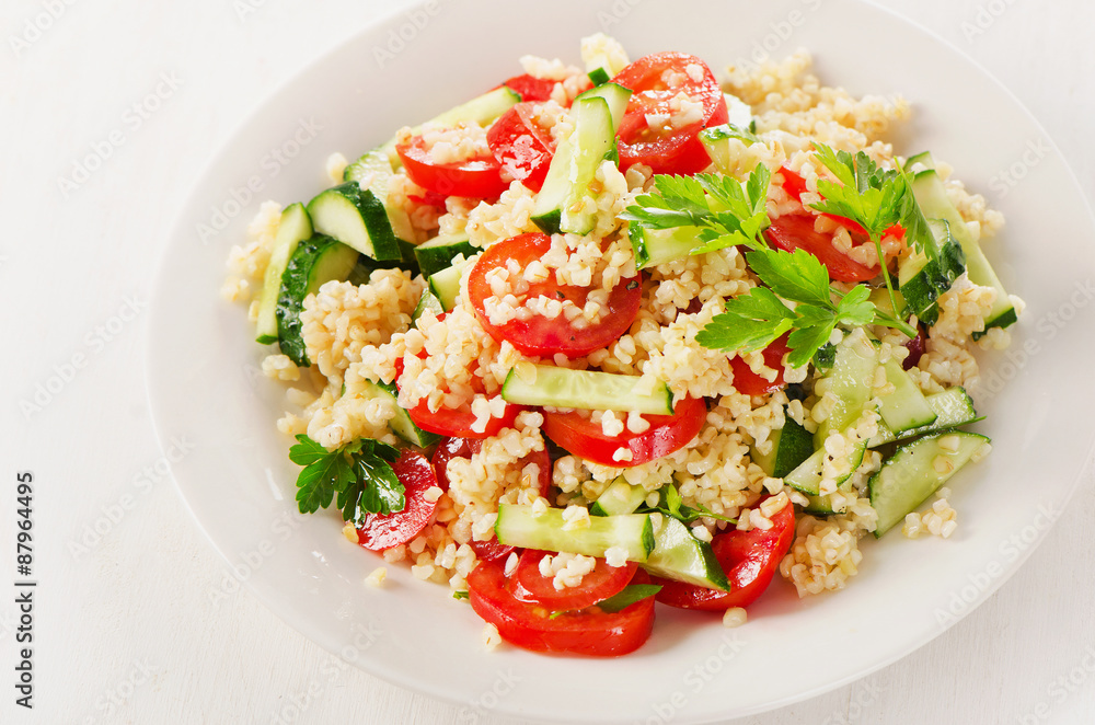 Healthy vegetable salad on  white plate.