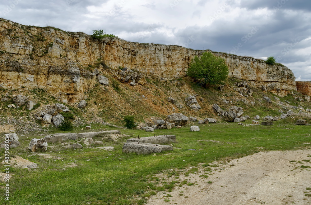 General view toward crag of sedimentary rock in the field, Ludogorie, Bulgaria General view toward crag of sedimentary rock in the field, Ludogorie, Bulgaria