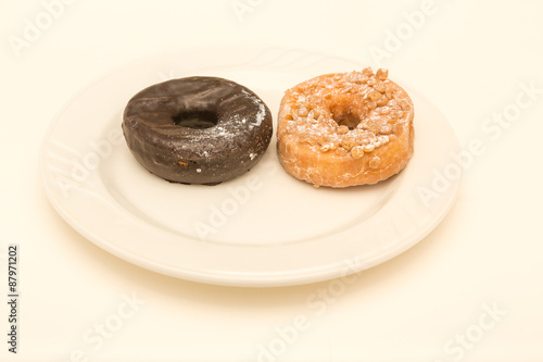 Two Cake Donuts on White Plate