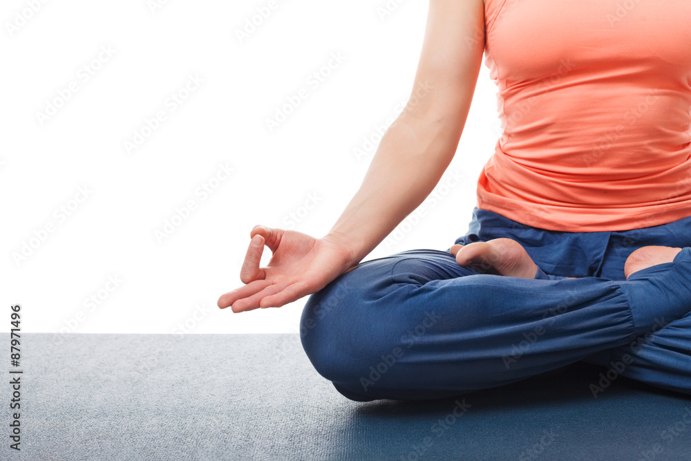 Close up of of woman in yoga asana Padmasana Lotus pose