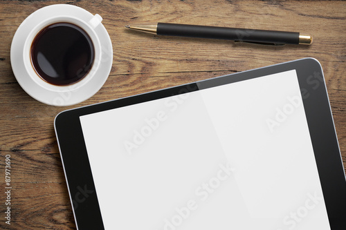 Tablet pc on table desk wit...