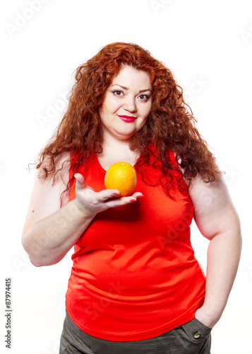 the fat woman with orange juice vegetable fruit holding isolated on the white background