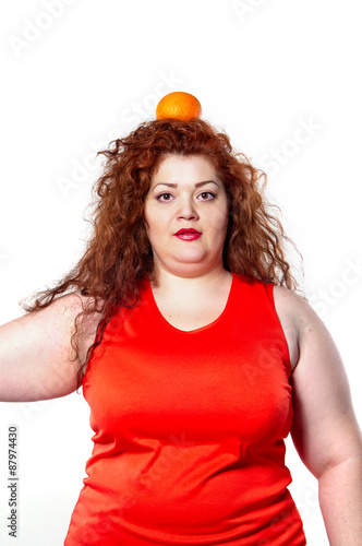 the fat woman with orange juice vegetable fruit holding isolated on the white background