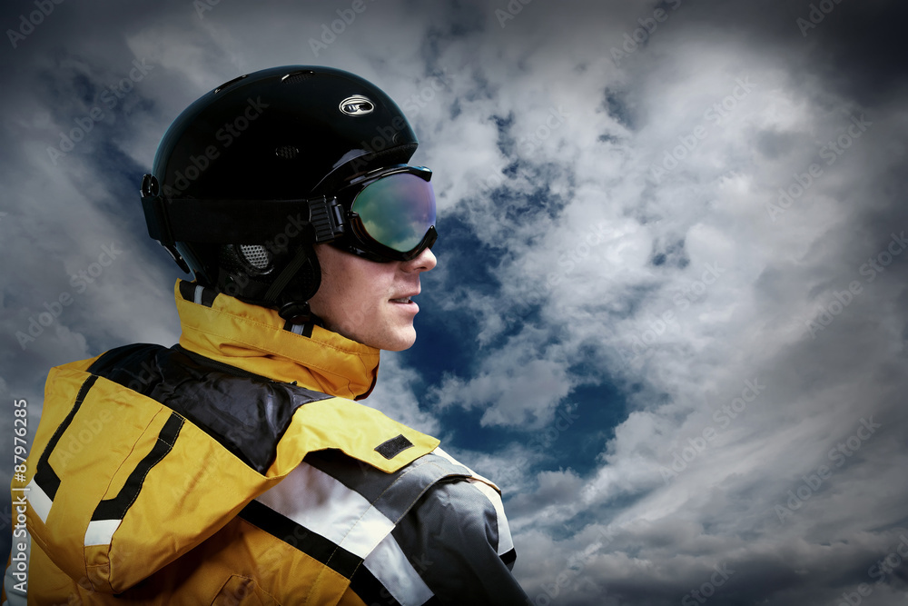 Portrait of man wearing a helmet and glasses on the background o Portrait of man wearing a helmet and glasses on the background o