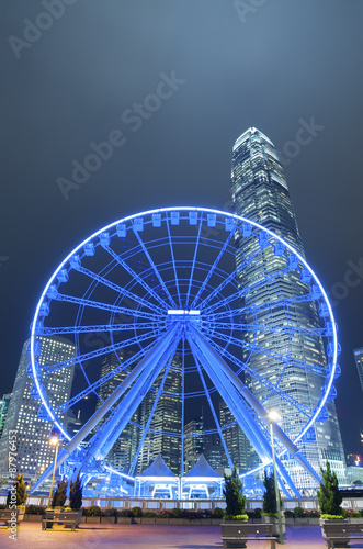 Ferris wheel with urban background