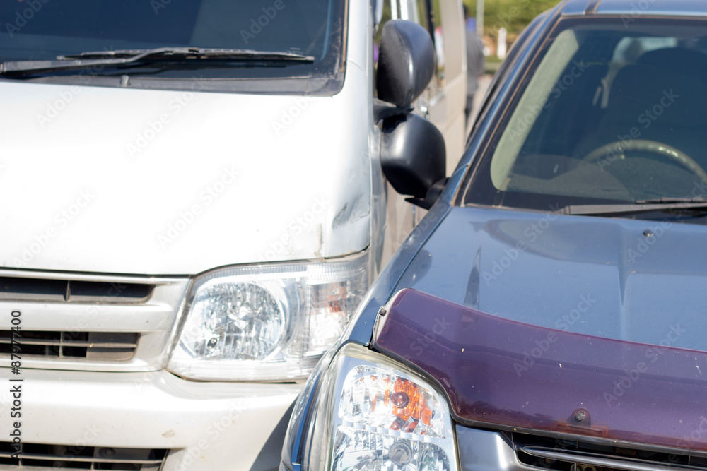 Auto accident involving two cars on a city street Auto accident involving two cars on a city street