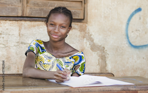 Back To School: African Teenage Girl Smiles in Public School photo
