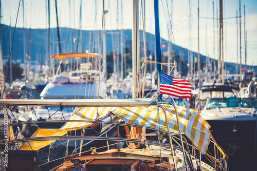 American flag waving from a sailboat 