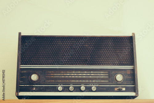 Vintage fashioned radio on white background