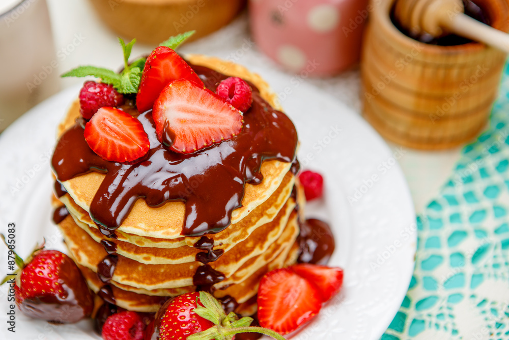 Stack of pancakes on wooden background