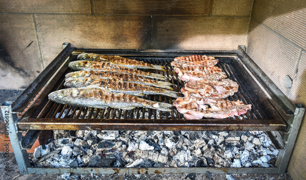 Fish and steak on the charcoal grill together