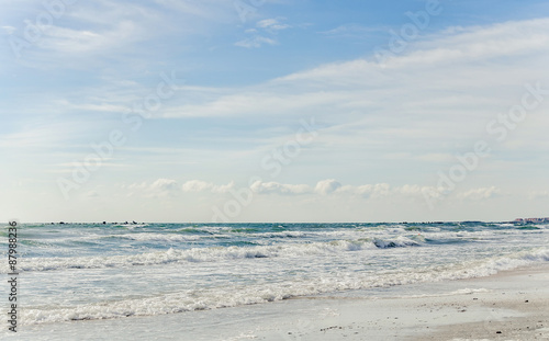 The Black Sea beach with sand and water  blue sky clouds  seaside