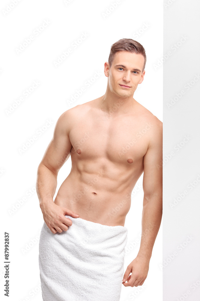 Handsome man with a bath towel around his waist