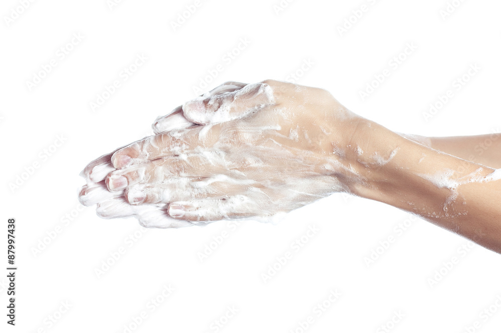 Woman washes her hands. pictured female hands in soapsuds. Isola Woman washes her hands. pictured female hands in soapsuds. Isola