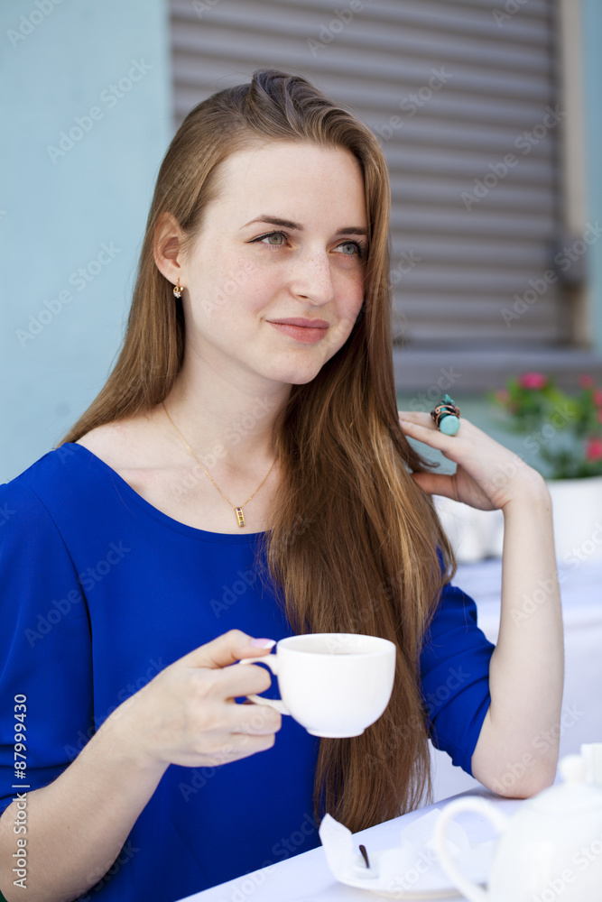 Pretty young blonde woman sitting in the cafe Pretty young blonde woman sitting in the cafe